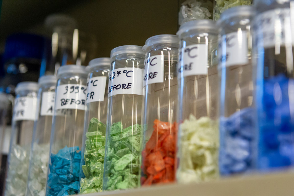 Glass jars with plastics sorted by colour before pyrolysis
